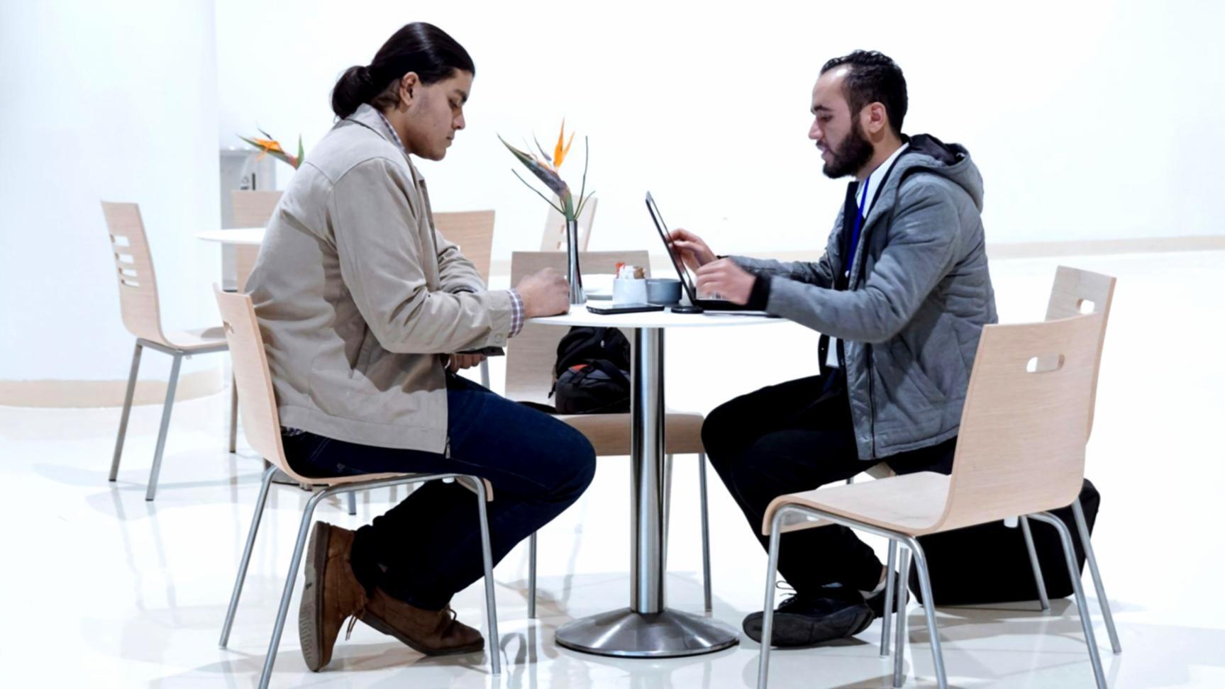 Business team reviewing financial reports and working capital metrics in a modern conference room setting